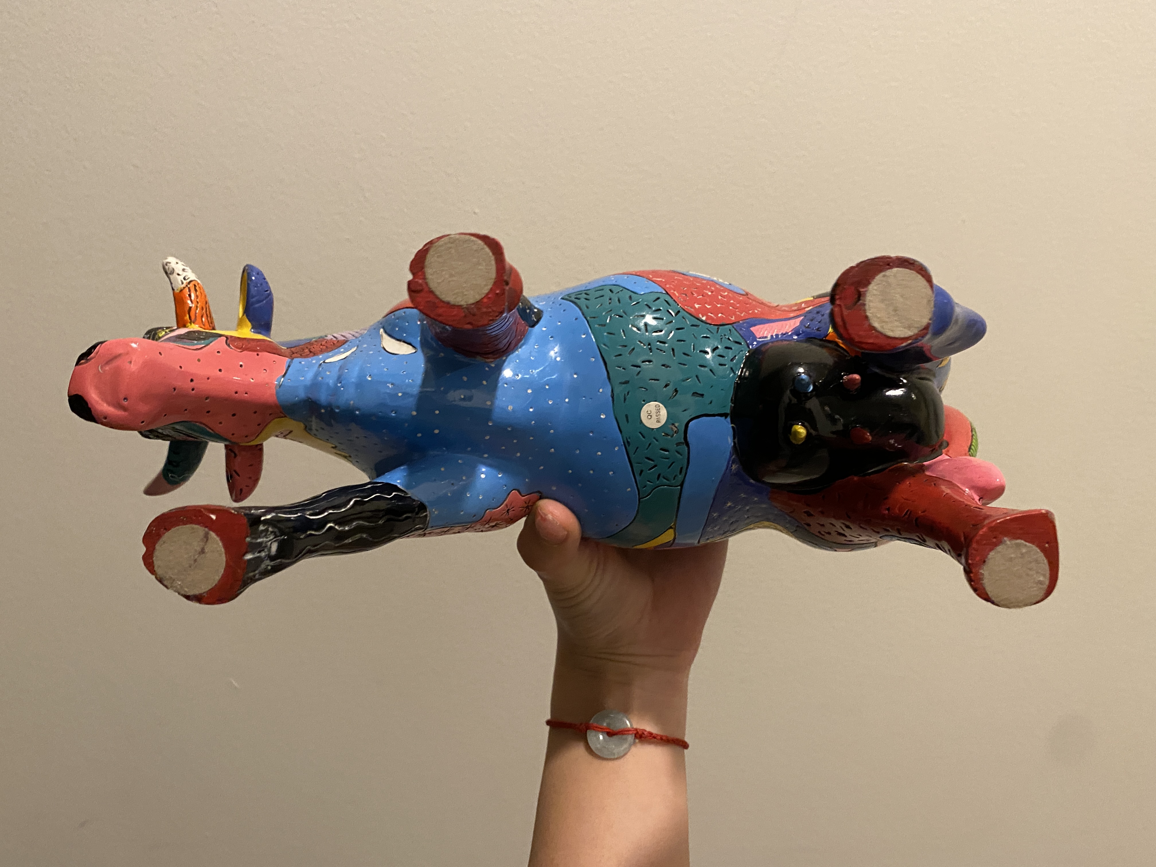 the bottom of the funky cow. here we can see her hooves and her blue belly.